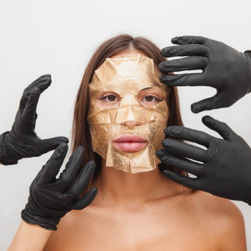 a-young-girl-with-a-mask-on-her-face-cosmetic-pro-min a-young-girl-with-a-mask-on-her-face-cosmetic-pro-min