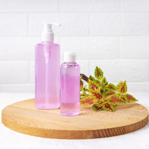 cosmetic-bottles-on-a-wooden-board-on-a-gray-backg-min cosmetic-bottles-on-a-wooden-board-on-a-gray-backg-min