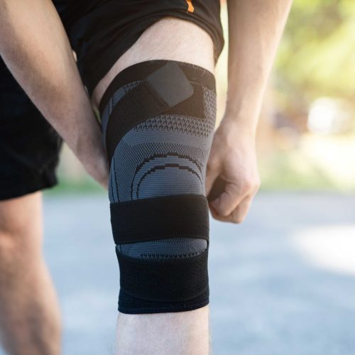 knee-support-brace-on-male-legs knee-support-brace-on-male-legs