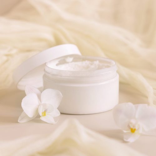 opened-cream-jar-with-a-lid-near-orchid-flowers-an-min opened-cream-jar-with-a-lid-near-orchid-flowers-an-min