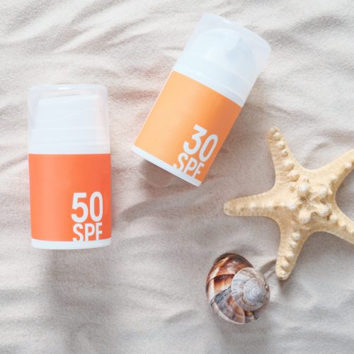 sun-tan-protection-creme-bottles-on-a-sand-next-min sun-tan-protection-creme-bottles-on-a-sand-next-min