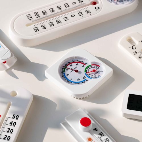 white-plastic-thermometers-on-a-white-surface white-plastic-thermometers-on-a-white-surface